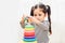 Beautiful baby girl kindergarten playing loop toy education