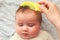 Beautiful baby girl with mother combing. Baby Hair Combs. Scalp Massage