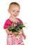 Beautiful baby girl with a posy of flowers