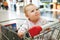 Beautiful baby girl in shopping cart - trolley