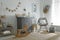 Beautiful baby room interior with toys, rocking chair and modern changing table