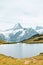 Beautiful Bachalpsee in the Swiss Alps photographed with famous mountain peaks Eiger, Jungfrau, and Monch. Alpine lake and