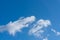 Beautiful background with bizarre clouds on a blue sky on a clear sunny day