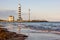 Beautiful background with images of a wonderful beach and a beautiful sea   . lighthouse on the shores of Jesolo beach at sunset.