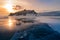 Beautiful Baikal siberia freeze water lake with rock and sunset sky