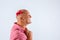 Beautiful bald positive man looking away with a bow on his head, a place to write, white background