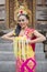 Beautiful balinese dancer with frangipani flowers