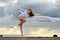 Beautiful ballerina is dancing at the beach