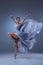 The beautiful ballerina dancing in blue long dress