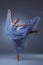 The beautiful ballerina dancing in blue long dress