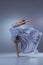 The beautiful ballerina dancing in blue long dress