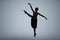 Beautiful ballerina dancing on light grey background, space for text. Dark silhouette of dancer