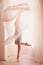 Beautiful ballerina girl with blond hair in ballet clothes and s