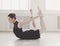 Beautiful ballerine practice bow pose, yoga stretching