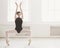 Beautiful ballerine stands in ballet plie position