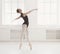 Beautiful ballerine stands in ballet position