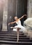 Beautiful ballet woman on stairs