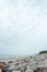 Beautiful baltic beach shoreside landscape view with rocks cloudy overcast weather.