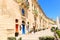 Beautiful baroque building with bright doors and shutters built with sandstone