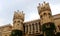 The beautiful battlement towers of bangalore palace with creeper plant.