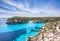 Beautiful bay with sandy beach and sailing boats, Menorca island, Spain