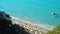 Beautiful beach aerial drone view shore seaside tourists people