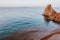 Beautiful beach with blue vivid turquoise water and red rocks