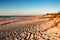 Beautiful beach with dunes and wooden walkway in Aveiro