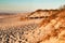 Beautiful beach with dunes and wooden walkway in Aveiro