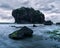 Beautiful Beach Exotic Rock and Dramatic Cloudy Sky