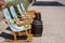 The beautiful beach front on the Island of Majorca in Spain showing deck chairs and beer barrel tables on the ocean front