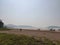 Beautiful beach image surrounded by mountain trees with awesome sky view village in India