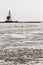 A beautiful beach and lighthouse at sunrise (Marken The Netherlands)