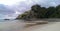 Beautiful beach with a nice promontory. Low Tide, cloudy sky, no People, untouched beach.