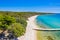 Beautiful beach on Pag island  Adriatic sea in Croatia. Pine woods and long sand beach with pier.