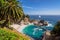 Beautiful beach with palm trees and the white yacht on the horizon