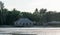 A beautiful beach resort beach front area showing cottages, trees and shore during low tide with sunlight shinning