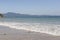 Beautiful beach in southern Brazil - City of Florianopolis. Beautiful view of greenish sea. Cloudless sunny day - clear sky in the