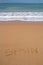 Beautiful beach with spain word written in sand