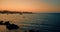 Beautiful beach at sunset with calm sea, in summer very popular, sandy coast have a fantastic view of island of ibiza. Moored