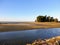 A beautiful beach view in Westport, New Zealand. It is a sunny day with blue sky.