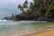 Beautiful beach with volcanic rocks and clear water in Sao Tome and Principe Island, in Africa