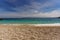 A beautiful beach where instead of sand there are small round pebbles overlooking the turquoise sea