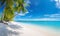 Beautiful beach with white sand, turquoise ocean, calm sky with blue clouds