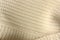 Beautiful beige knitted fabric close up view