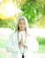 Beautiful best age Senior woman with long grey hair doing yoga exercises outdoors