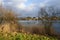 Beautiful Biesdorfer Baggersee lake surrounded by winter vegetation in January. Berlin, Germany