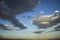 Beautiful big clouds and blue sky with mountains and moonlight