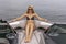 Beautiful Bikini Model Relaxing On A Boat By The Docks