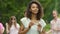 Beautiful biracial girl with snow-white teeth smiling and posing for camera